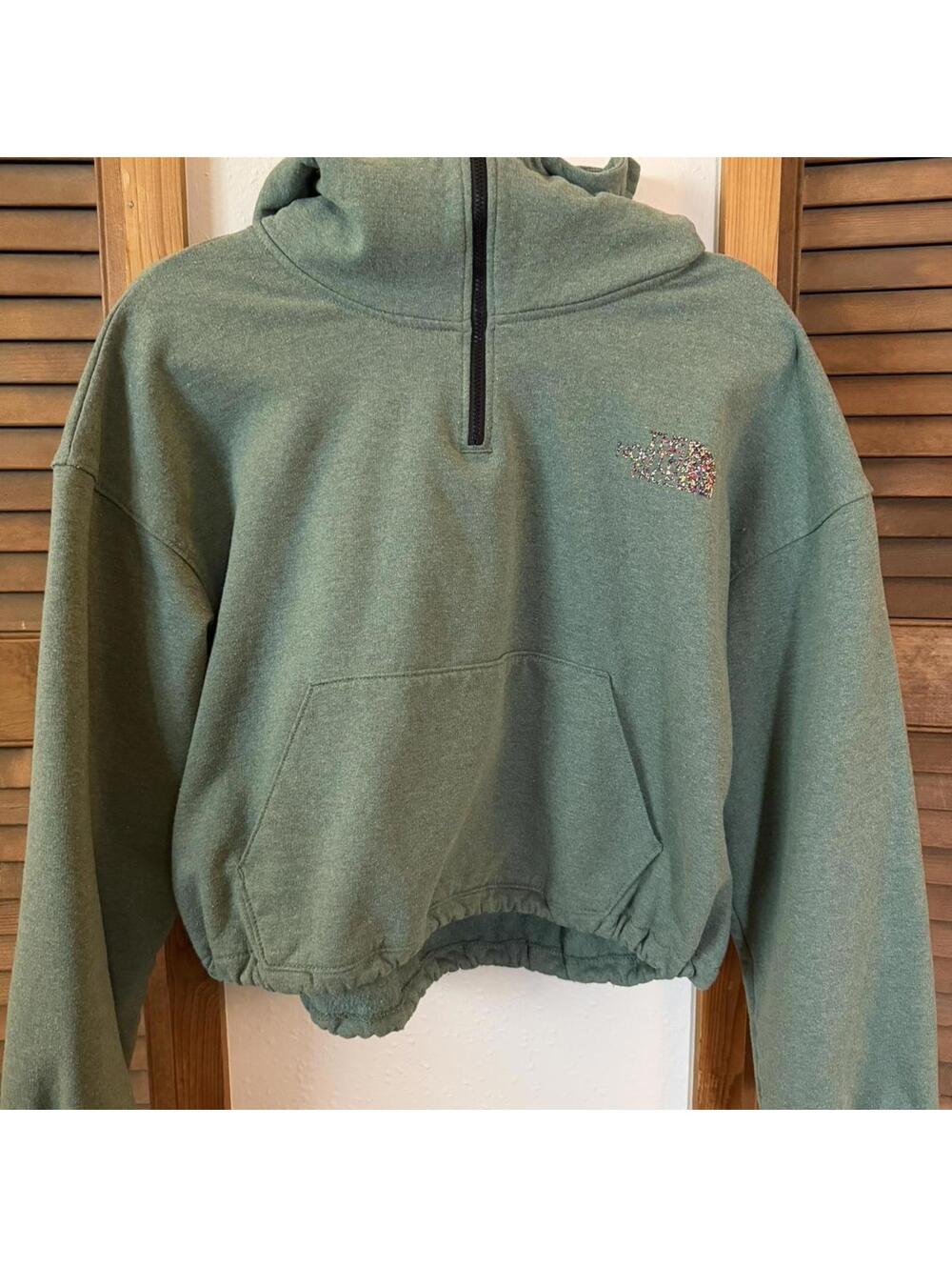 The North Face muted medium green cropped quarter zip